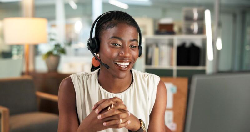 woman with tanktop and headset on