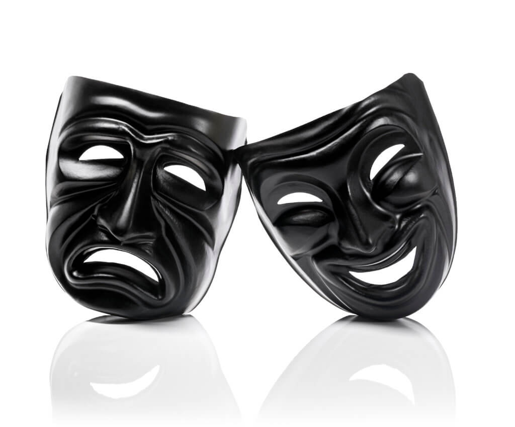 Generic plastic masks as theatrical symbols isolated on white with reflection