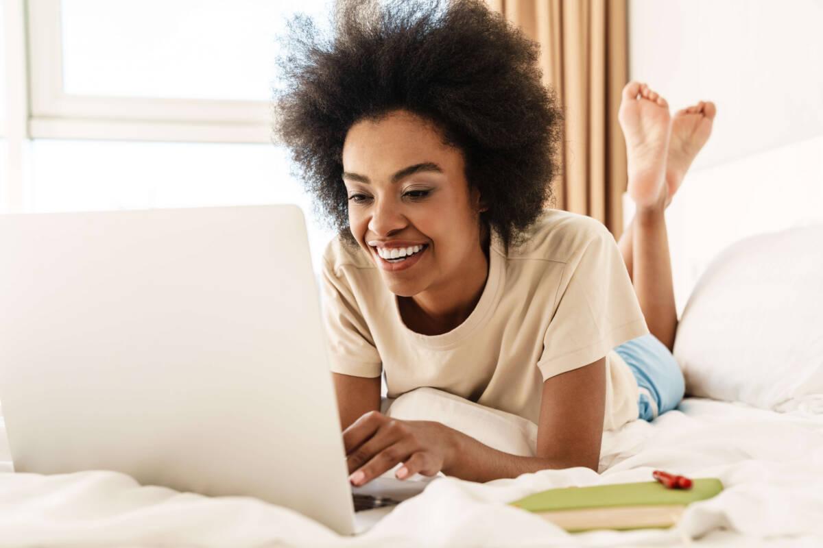 Cheerful woman using a laptop