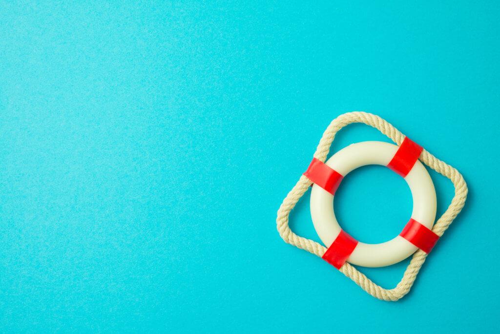 Red lifebuoy on blue background