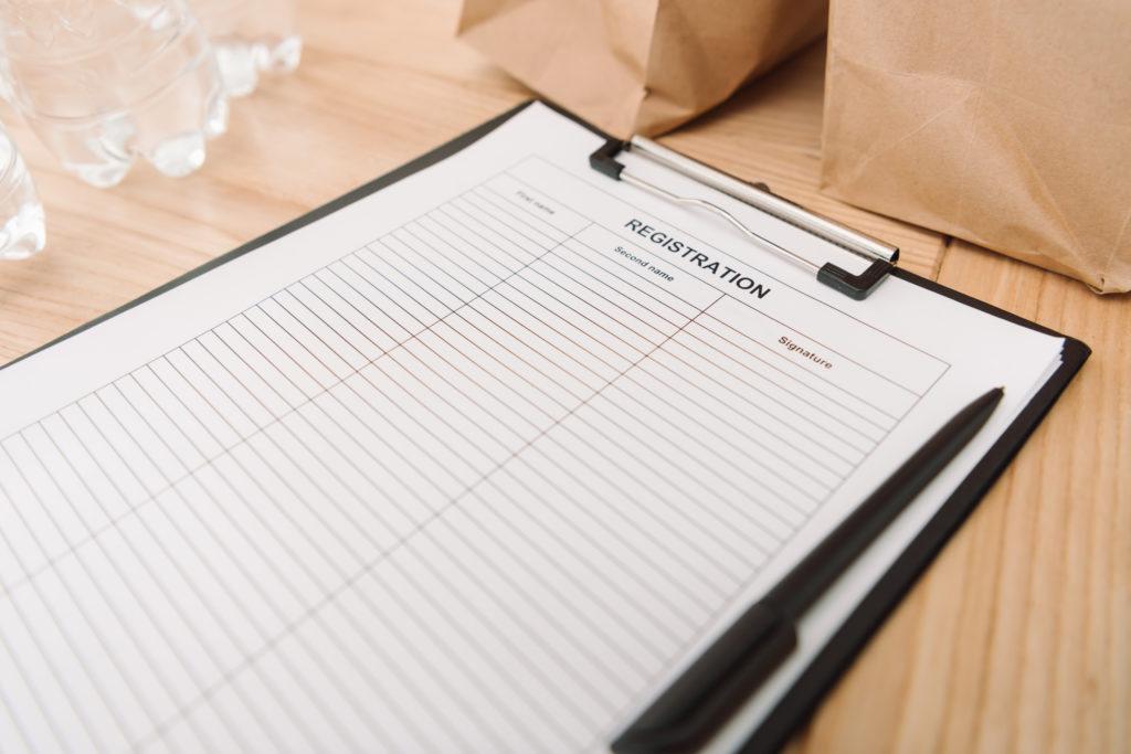 close-up shot of blank registration form on clipboard