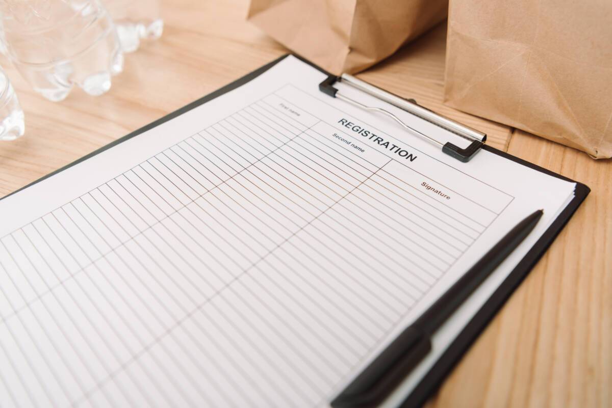 Close-up shot of blank registration form on clipboard