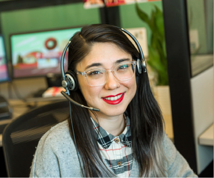 A Ruby receptionist smiles at the camera