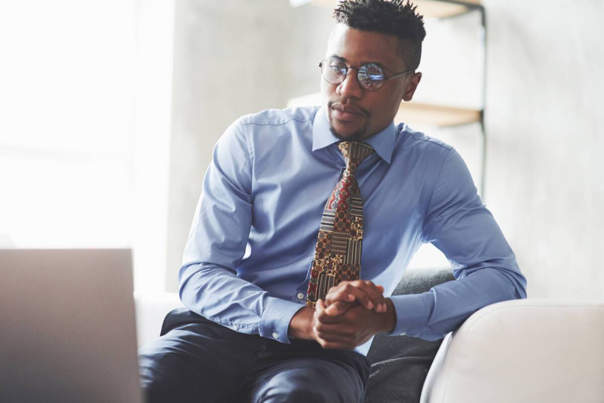 Top 3 legal marketing strategies for 2022: man looks at laptop