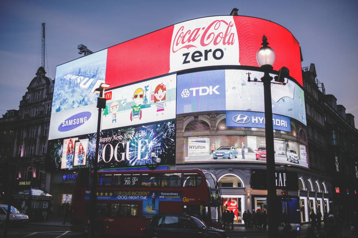 Digital billboards at an intersection in London | Photo by Negative Space from Pexels ( https://www.pexels.com/photo/photo-of-commercial-district-during-dawn-34639/?utm_content=attributionCopyText&utm_medium=referral&utm_source=pexels)