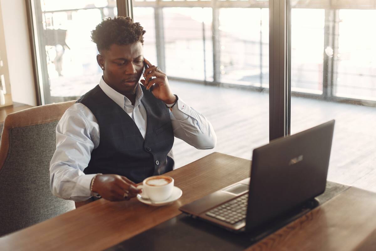 Attorney using laptop in a cafe