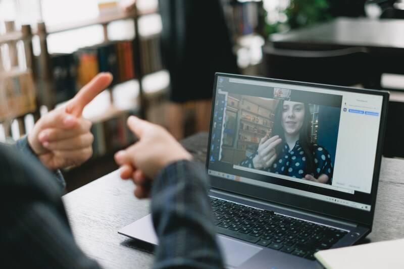 Two people using sign language over video chat