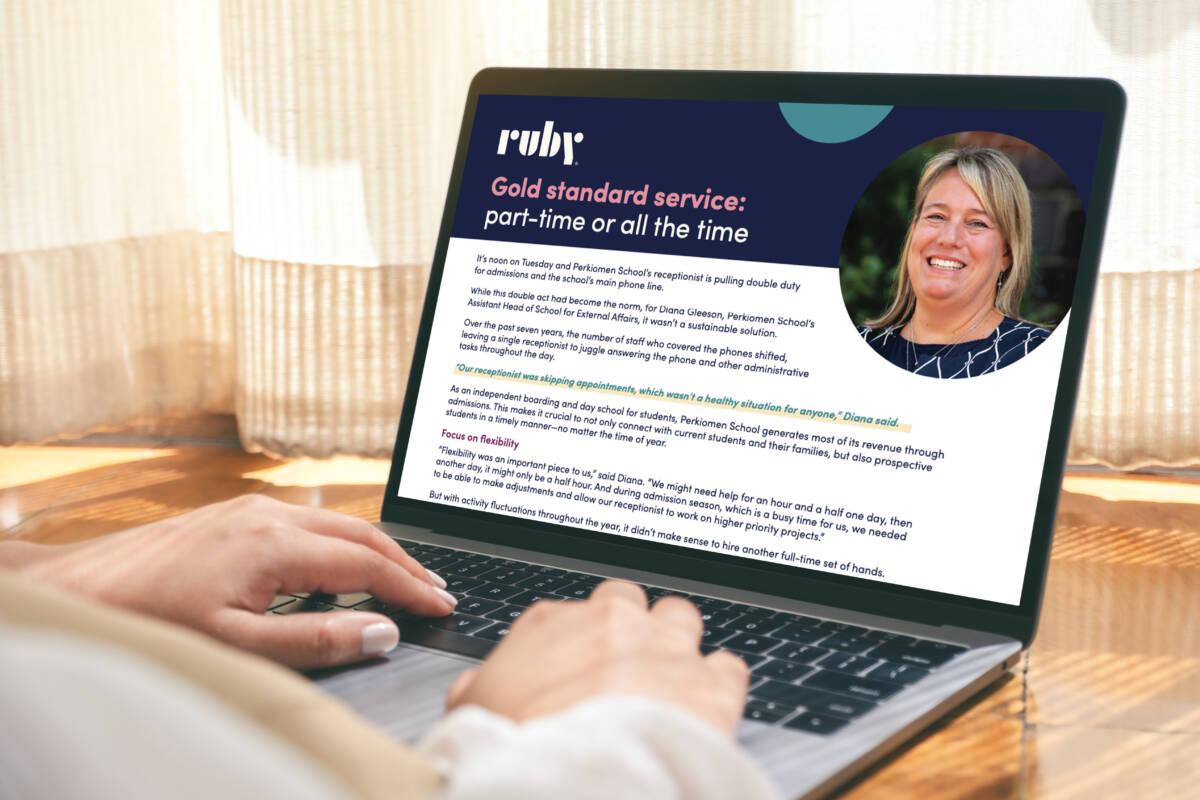 Photo of person using computer and reading Ruby's Perkiomen School case study about using virtual receptionists for part-time and backup support