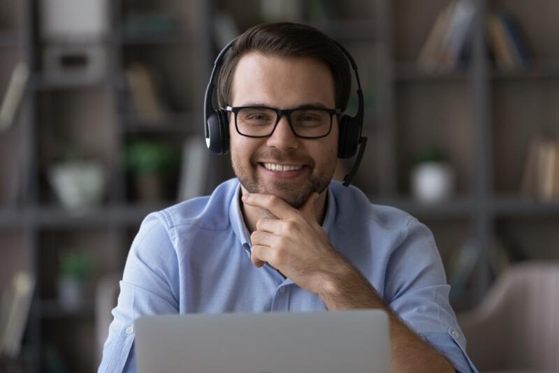 man smiling with headset