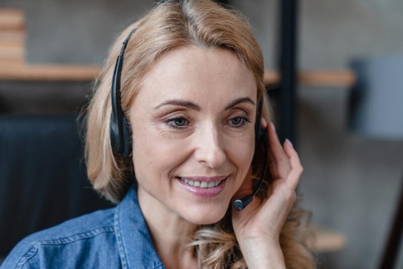 closeup of female virtual receptionist actively taking a call