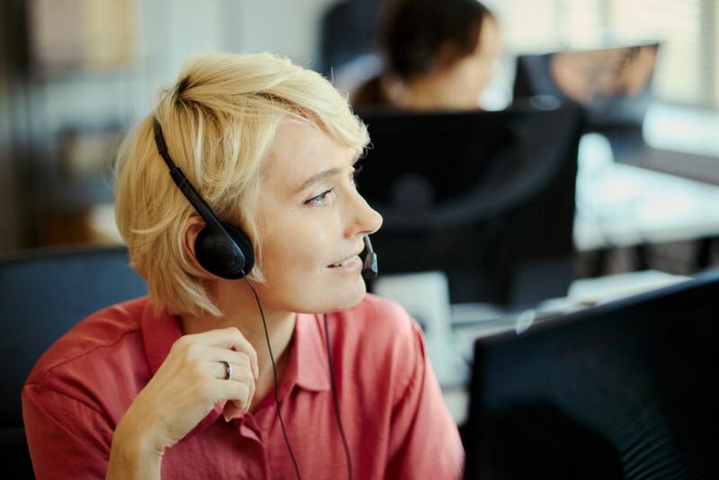 female virtual receptionist with short hair looking out the window